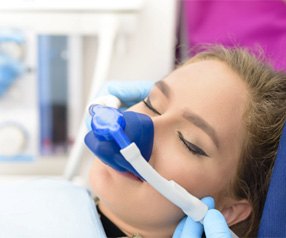 Woman relaxing with nitrous oxide sedation at the dentist’s in Tyler