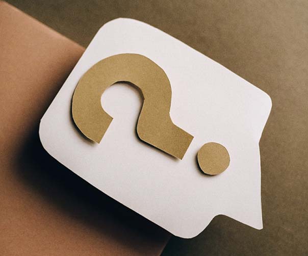 Question mark cut out on paper